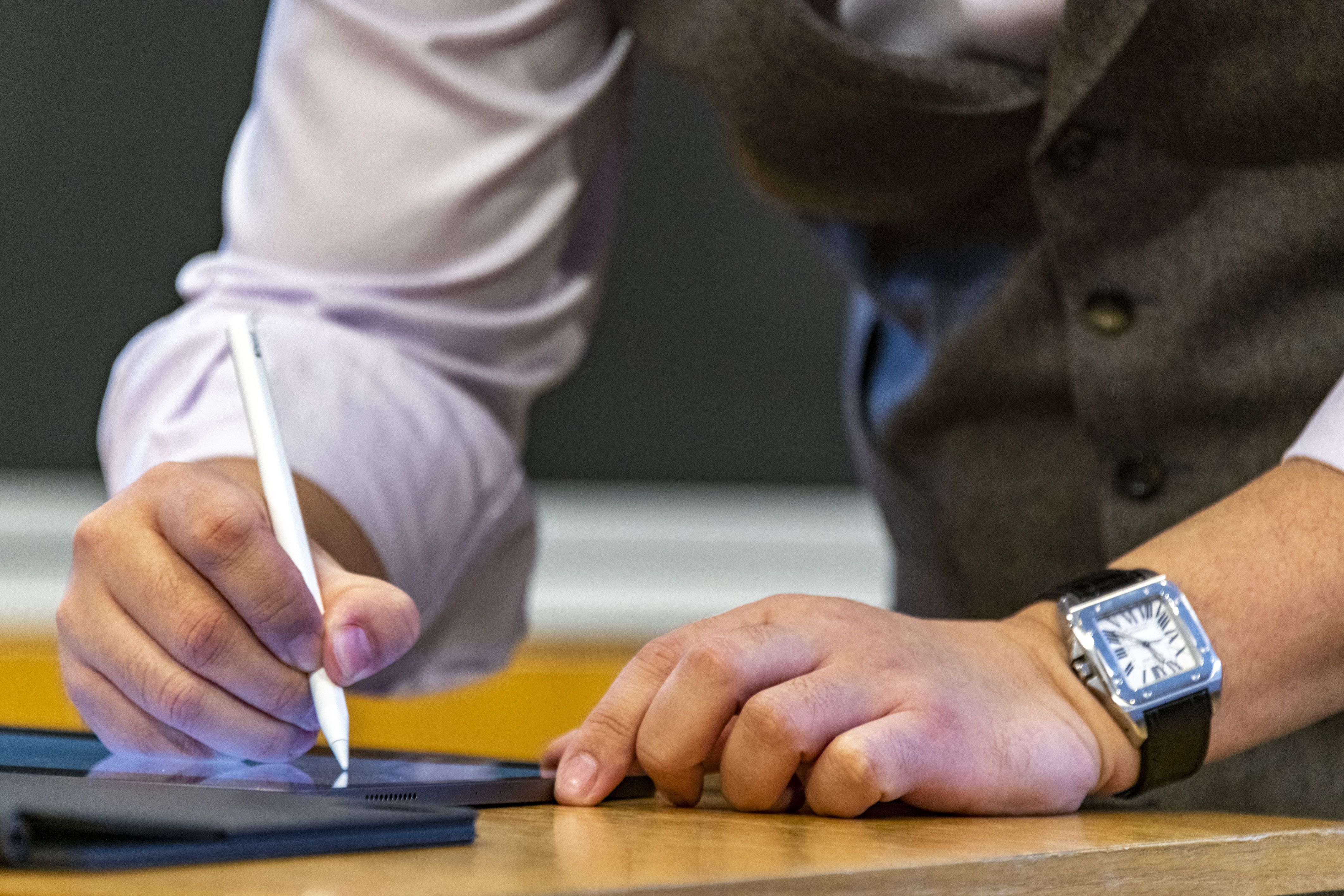 Photo of person working on tablet
