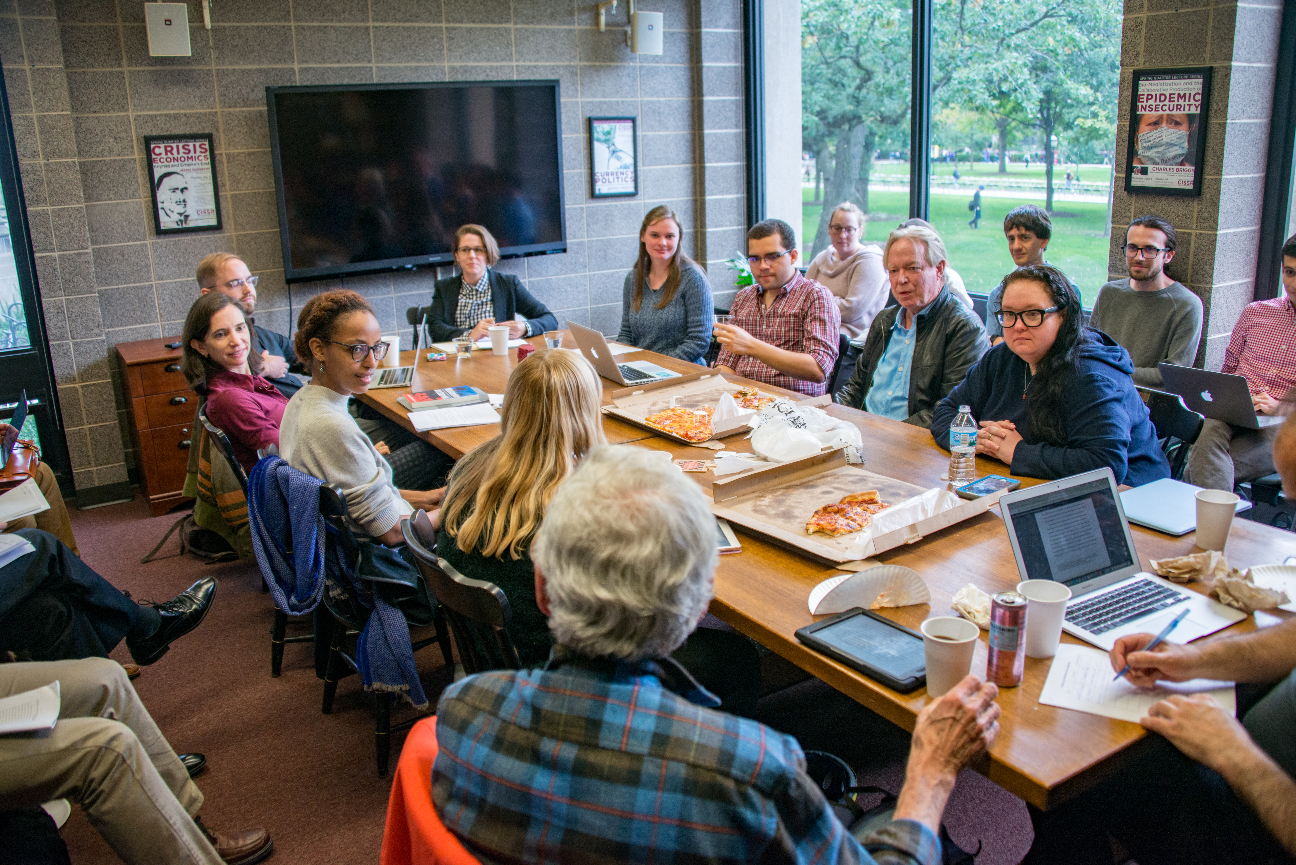 Photo of UChicago students and Faculty engaged in a course discussion