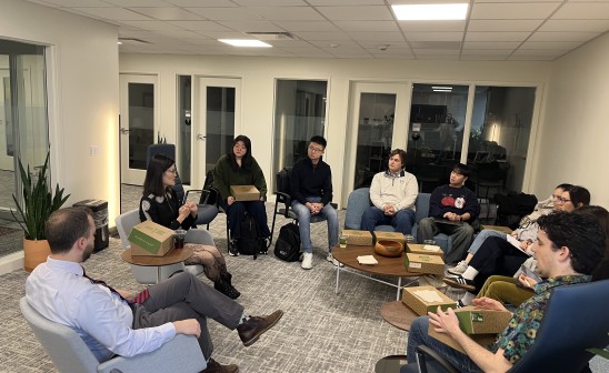 Yangyang Cheng sits with CIR students and CIR AIP Adam Parker