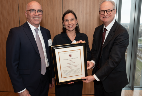 Jenny Trinitapoli, center, receives 2025 gordon j laing prize